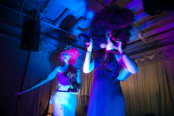 Artist, Drew Johnson, introducing the costume contest prizes. Photo by Fun Loving Photos