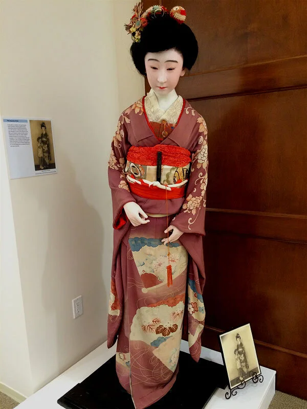 In the museum, this doll was kept in a vertical glass case the size of a phone booth.