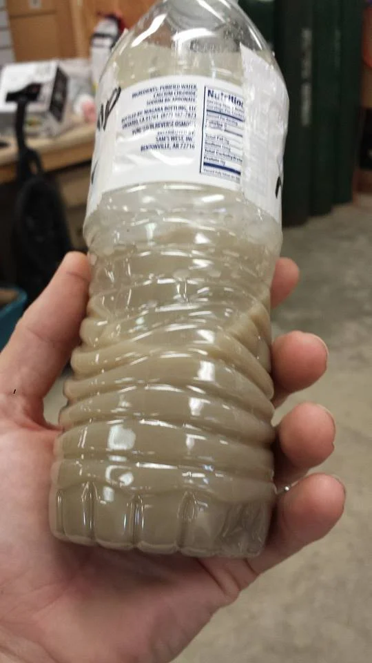 Oil mixed with water that came out of a cylinder needing VIP, in turn obviously requiring cleaning and tumbling.