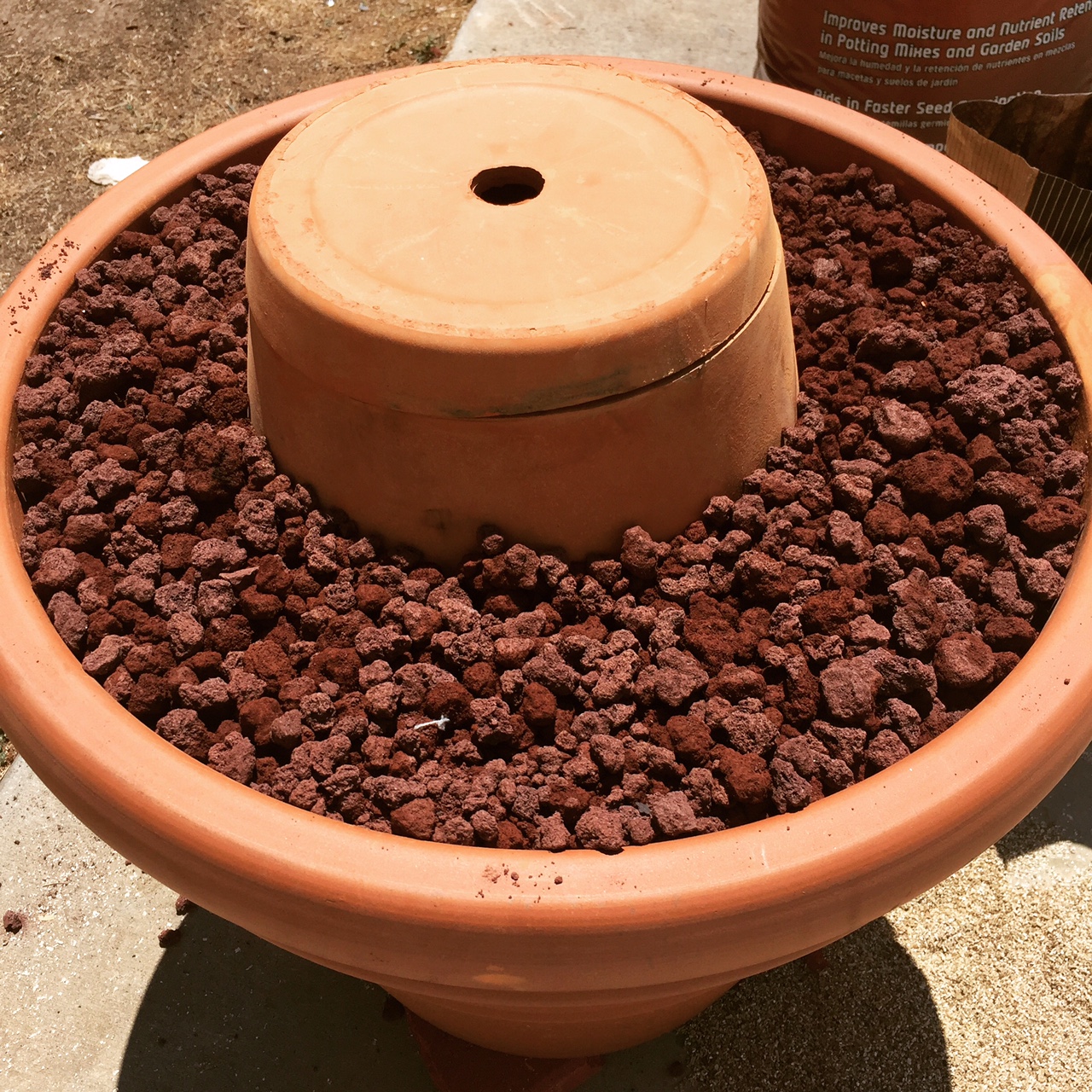  Put the lid on and fill the remaining space with lava rock or coarse vermiculite. 