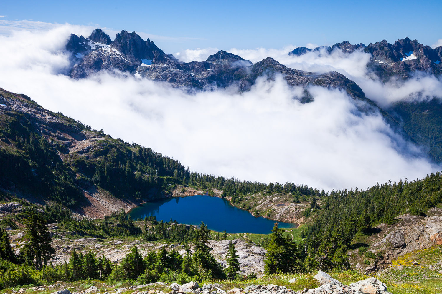 The view from 50-40 towards Cobalt Lake with Triple Peak in the upper left corner. If you look closely, you can see our tiny tents on the right side of the lake!