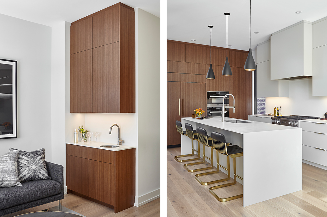 Modern kitchen with wood cabinetry, white countertops, and a central island with bar stools