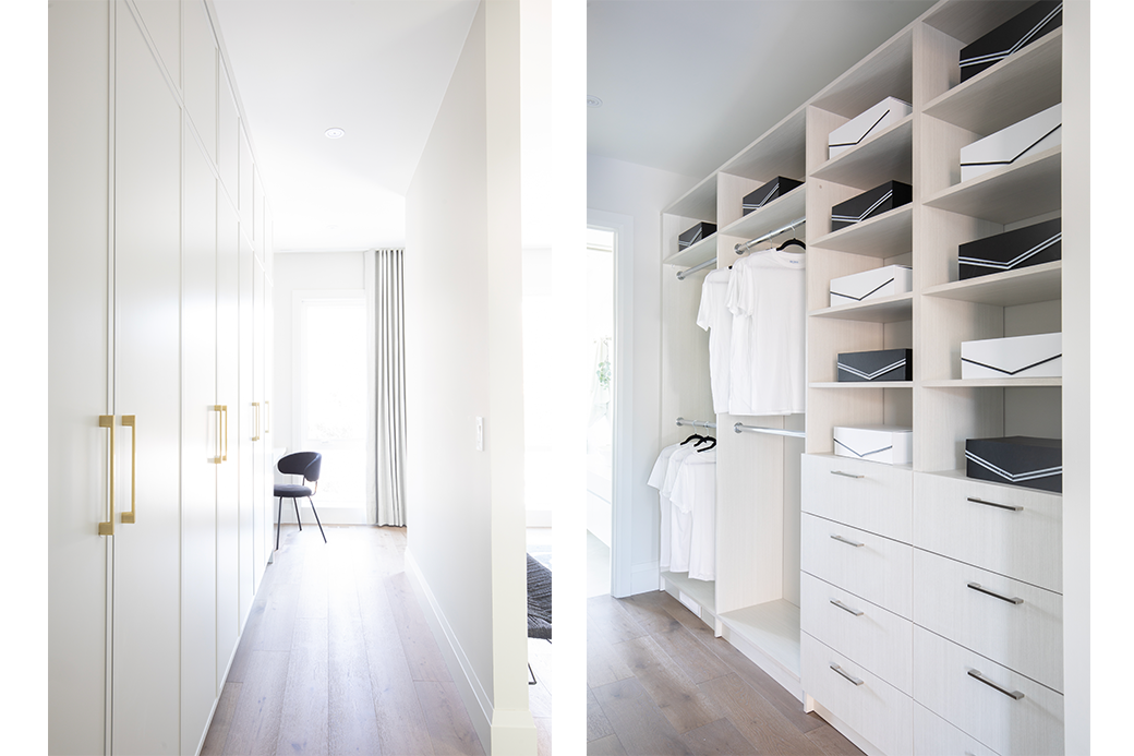 Modern walk-in closet with white shelves, drawers, and hanging clothes, alongside a hallway with floor-to-ceiling cabinets and a chair by a curtain-covered window.
