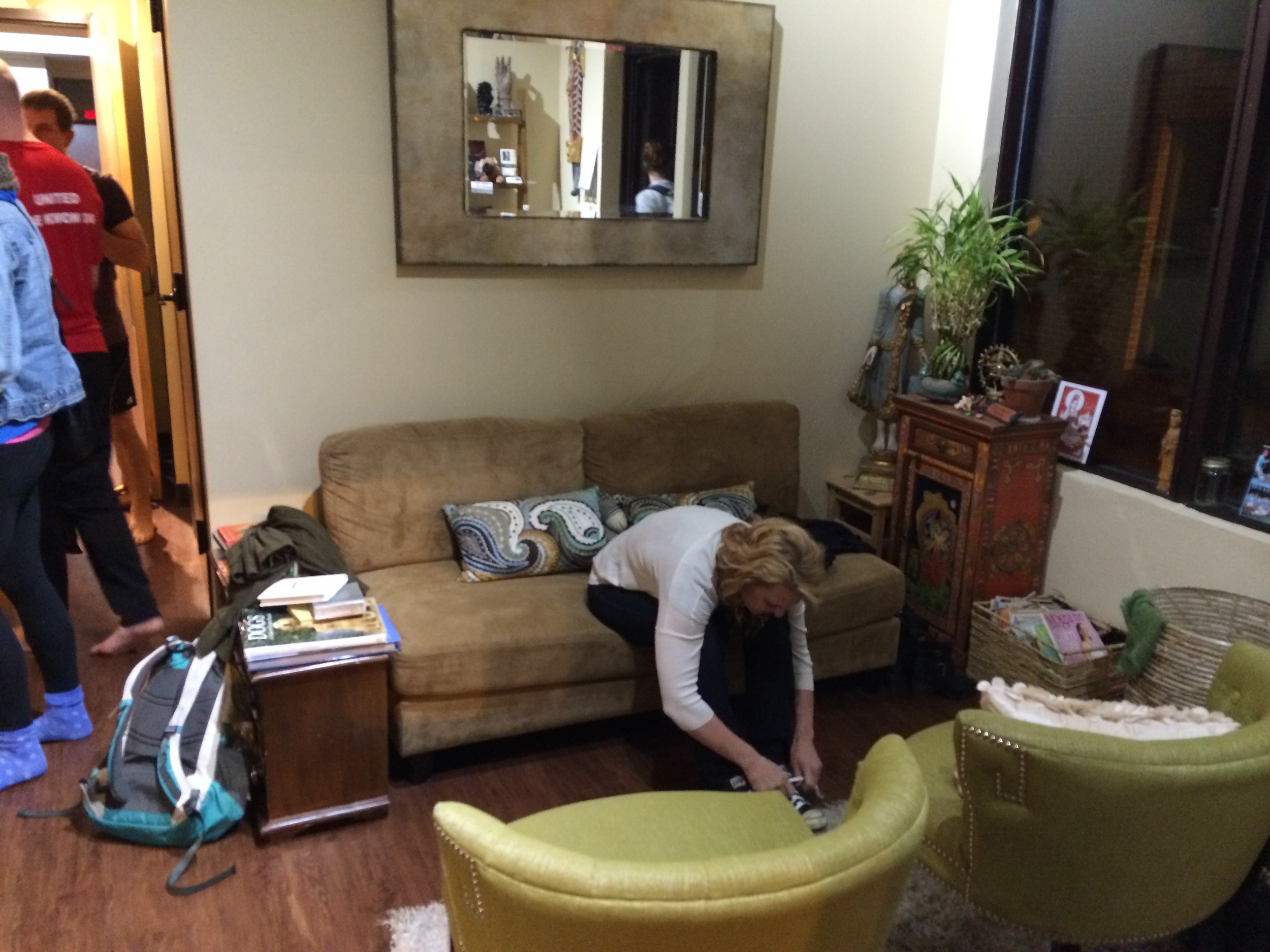 Note the student's book bag placed by the sofa