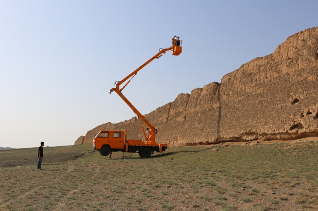   Camera crew craning high above the Great Wall, Ningxia Province, border with Inner Mongolia, NW China  