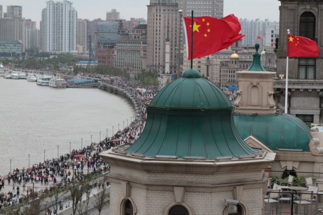  Flags fly from Colonial buildings above the Bund, Shanghai 