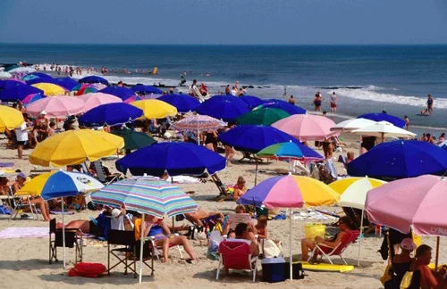 This is not the way most of the Western world enjoys the beach but sun avoidance is the best advice I can offer.