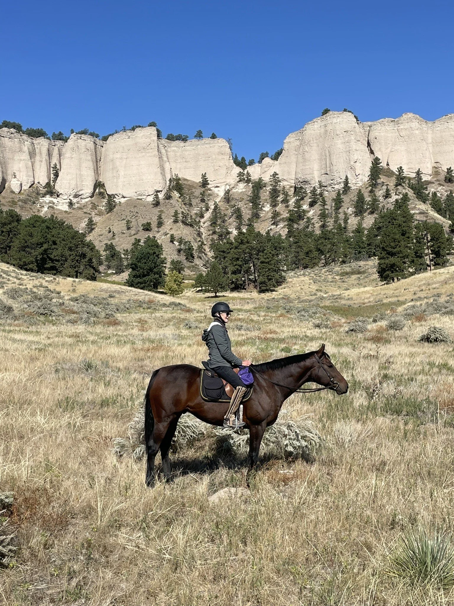 Jody on Horseback Tall Moutains.jpg
