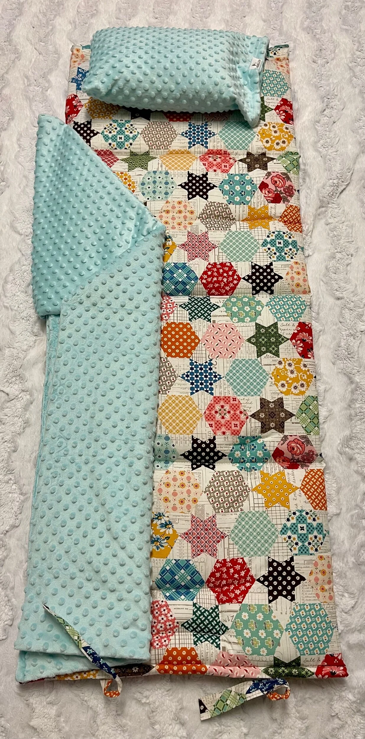 Janiebee Quilted Nap Mat Ava Patchwork Toddler Nap Mat brown, ivory, sage Cheater print to look like quilt top. Naps guaranteed from janiebee.com