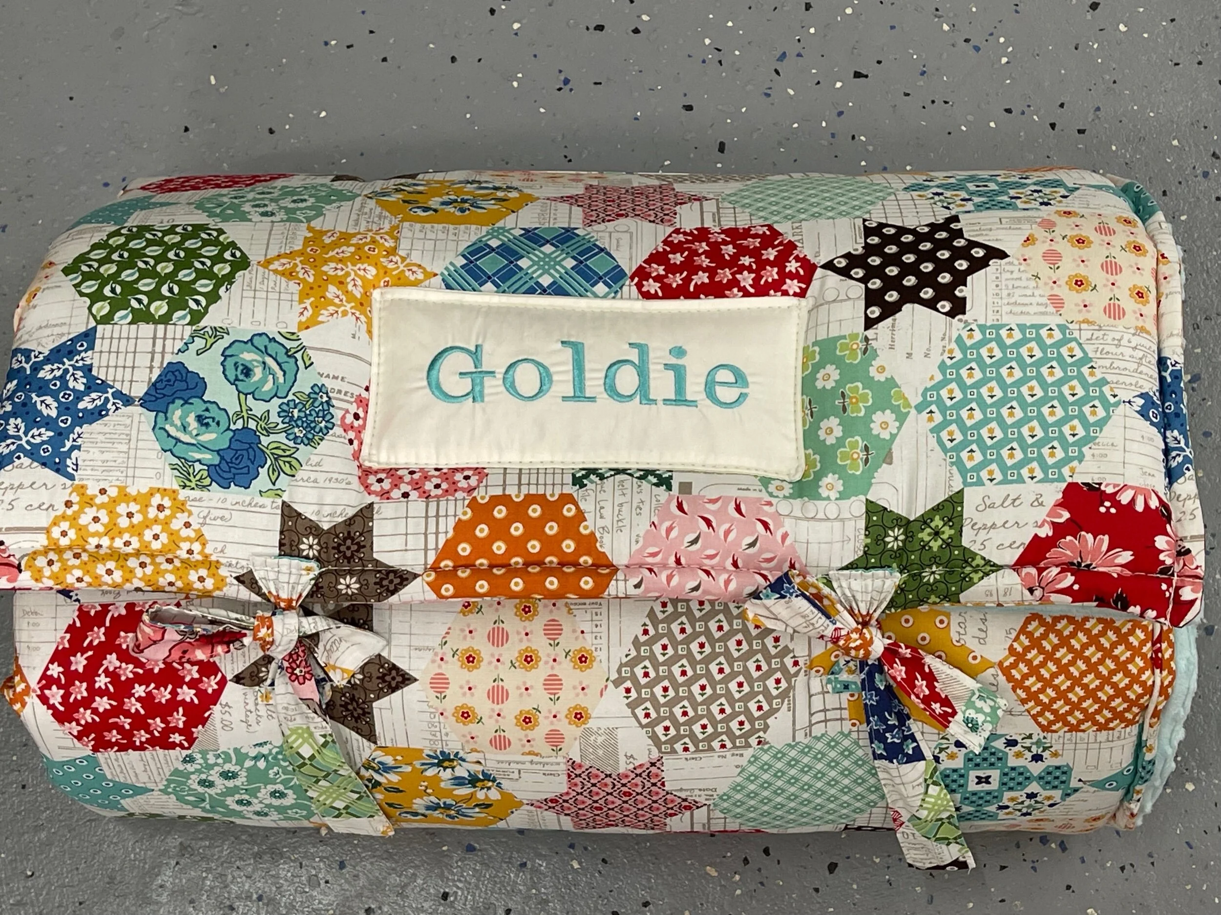 Janiebee Quilted Nap Mat Ava Patchwork Toddler Nap Mat brown, ivory, sage Cheater print to look like quilt top. Naps guaranteed from janiebee.com