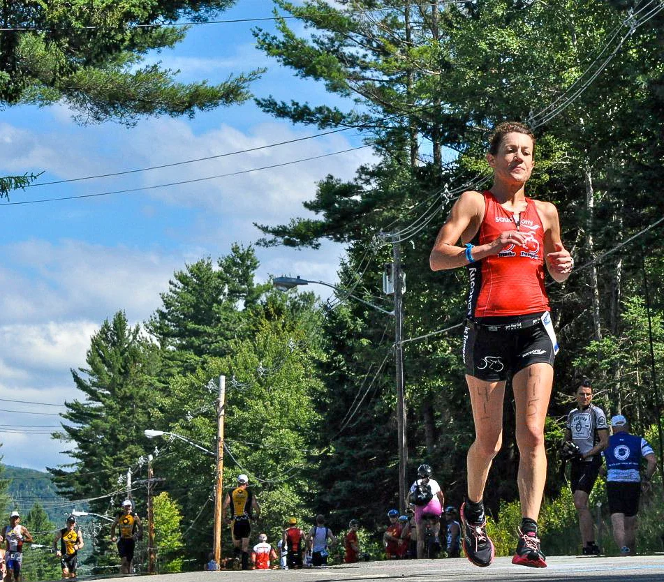  A woman heads uphill during the running leg of a triathlon in Lake Placid, New York.&nbsp; 