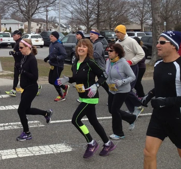 Jeri Cavagnaro, at the center of the pack, ran in her third race this year at Cedar Creek Park in Seaford in March. (Credit: Jeri Cavagnaro)