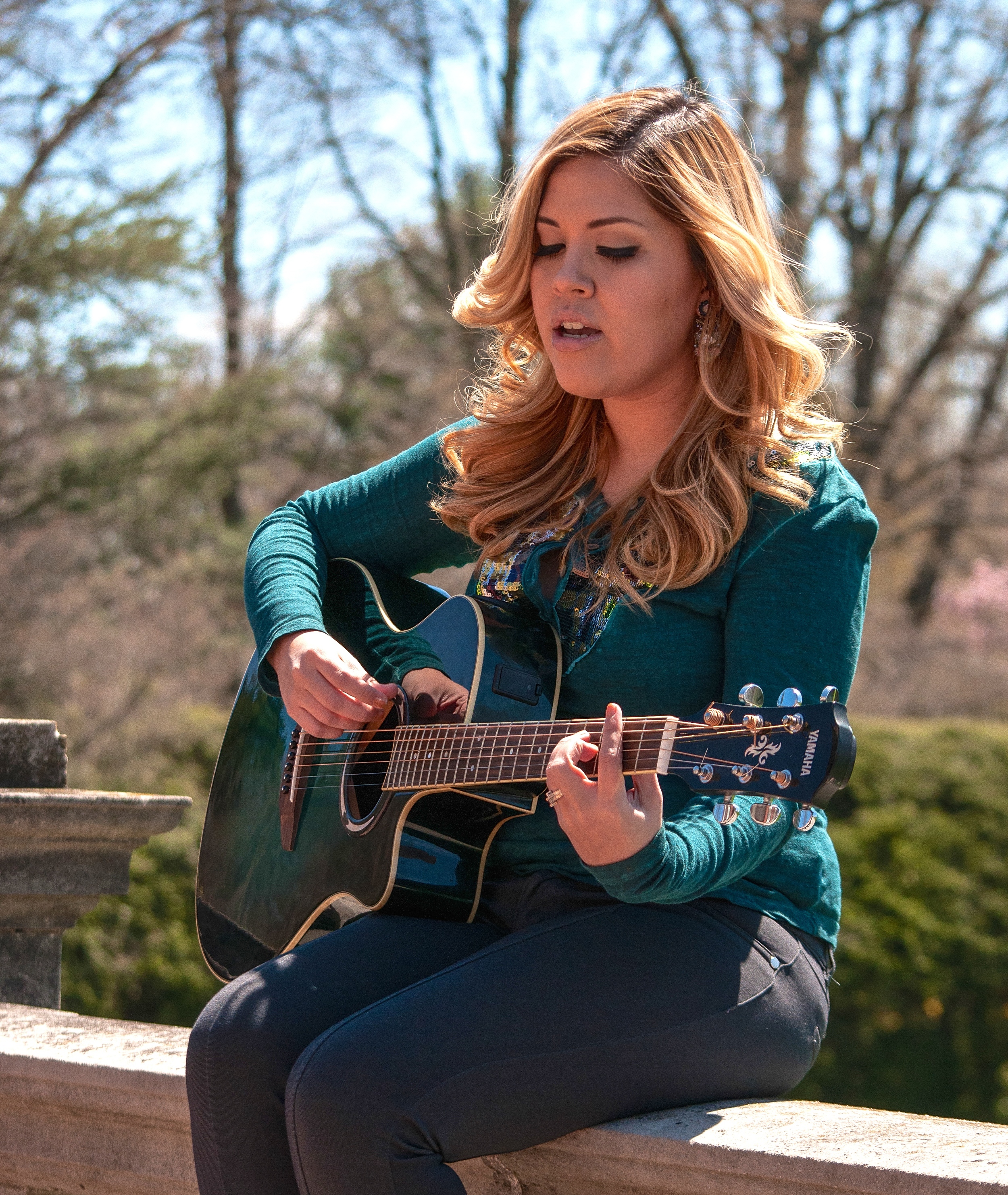   Strumming a guitar at Old Westbury Gardens, Old Westbury.   