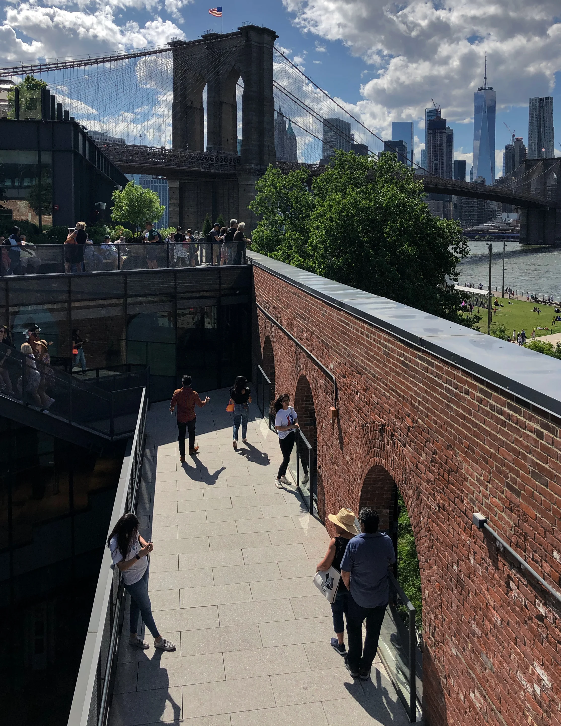 Housed in a former warehouse and coffee roasting facility, Empire Stores features retail shops, restaurants, a rooftop beer garden, and a museum of the Brooklyn Historical Society. I took this picture from the same perch as the top shot above but with a focus on the roofless observation deck.