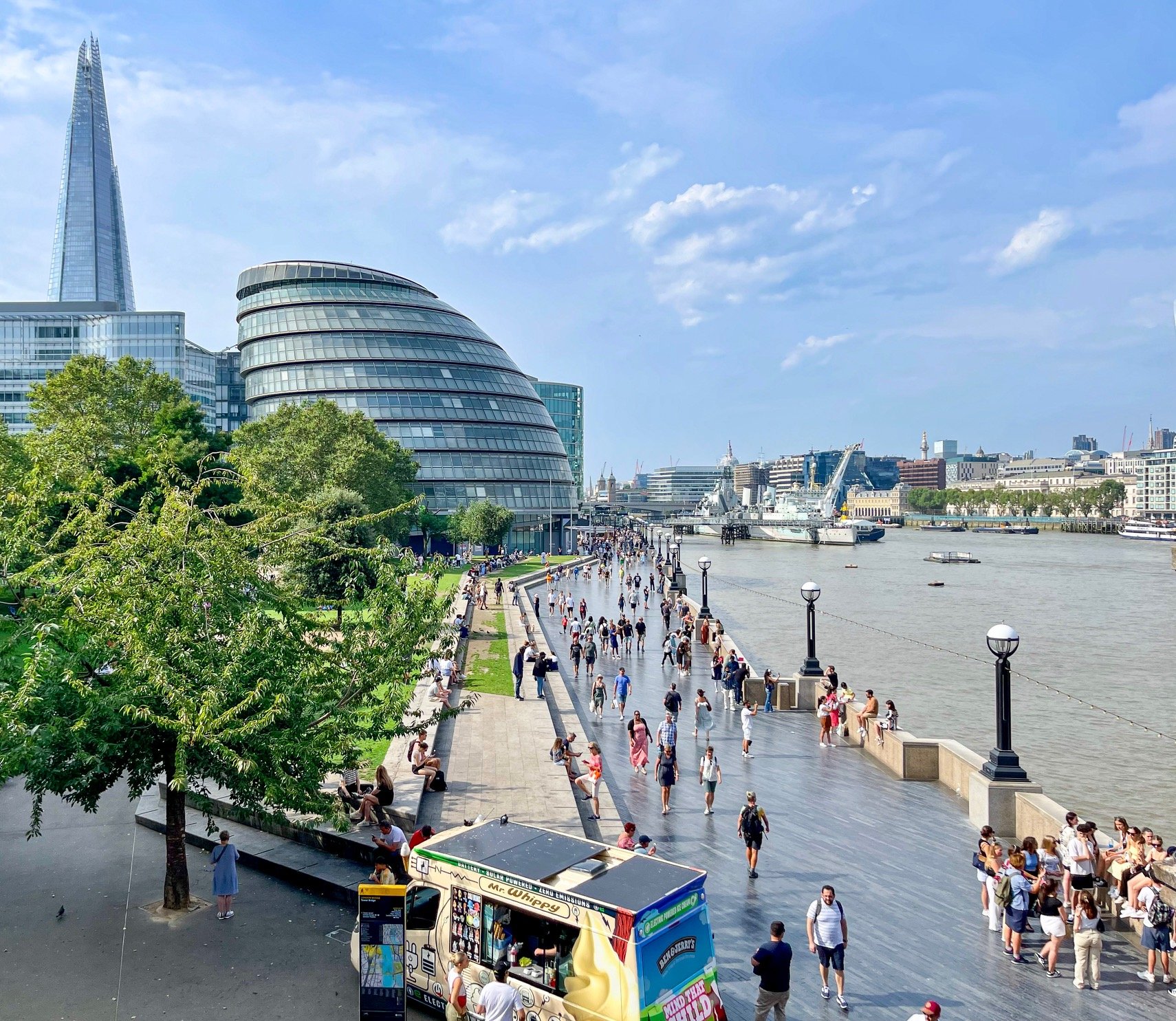 A view of Queen’s Walk, a pedestrian path that meanders along the south bank of the Thames River in London. The promenade extends 2.4 miles from Tower Bridge, from where I snapped this photo, to Lambeth Bridge. London City Hall and The Shard, the ta
