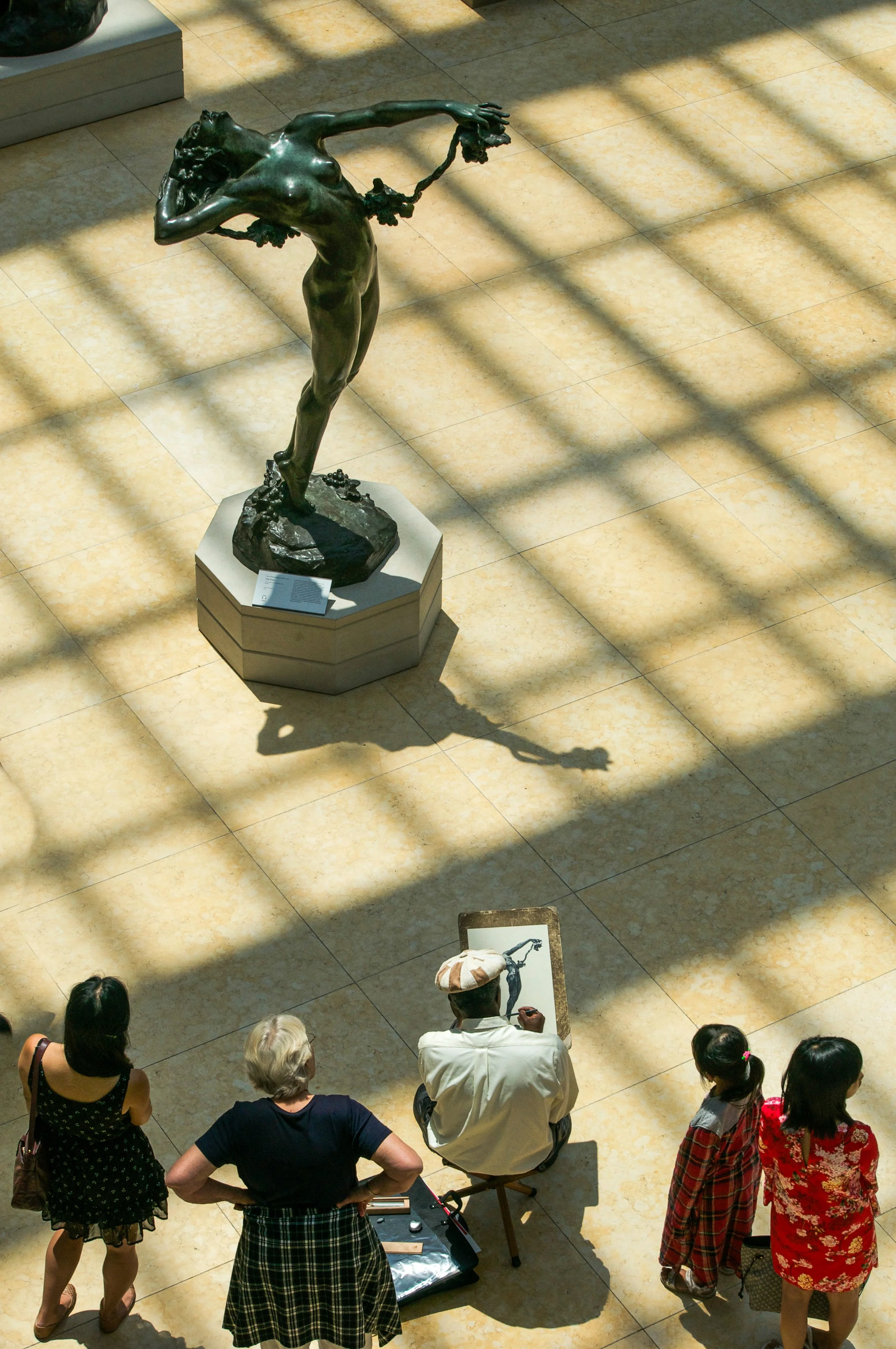  Onlookers watch an artist sketch The Vine in the American Wing of the Metropolitan Museum of Art.  