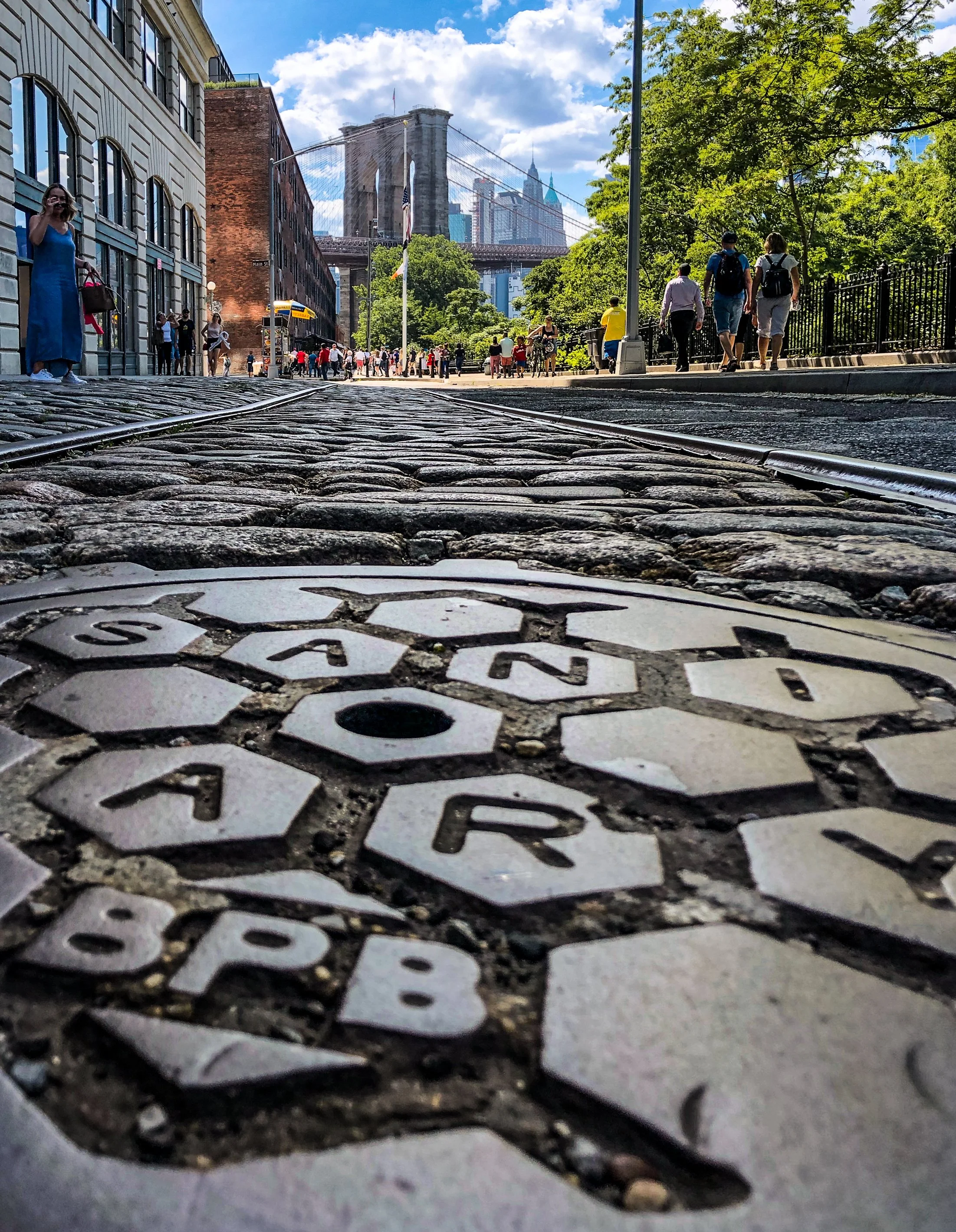   The cobblestone-paved Plymouth Street in the shadows of the Brooklyn Bridge in DUMBO.      (Photo © Joseph Kellard/kellardmedia.com)  