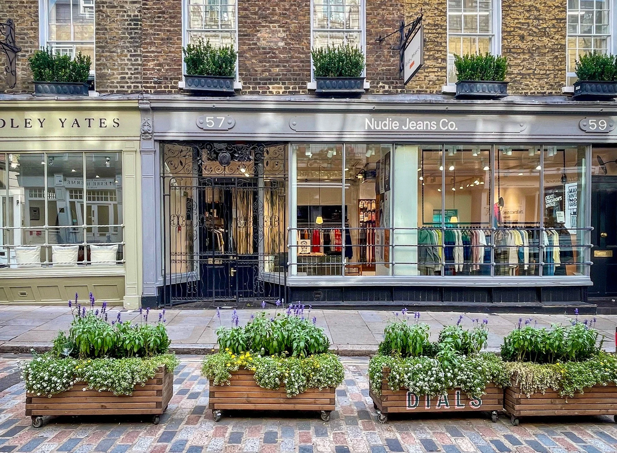  Nudie Jeans store is on Monmouth Street in London’s historic Seven Dials district. Founded in Gothenburg, Sweden in 2001 by Maria Erixon Levin and Joakim Levin, the organic cotton denim brand was “fueled by a love for dry denim, punk music, and snus