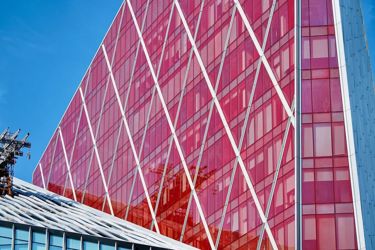 Nova Building is a mixed-use development combining residential, retail, and office space in London’s Victoria district. Completed in 2017 at 77 Buckingham Palace Road, the complex comprises three distinct structures. The red glass residential struct