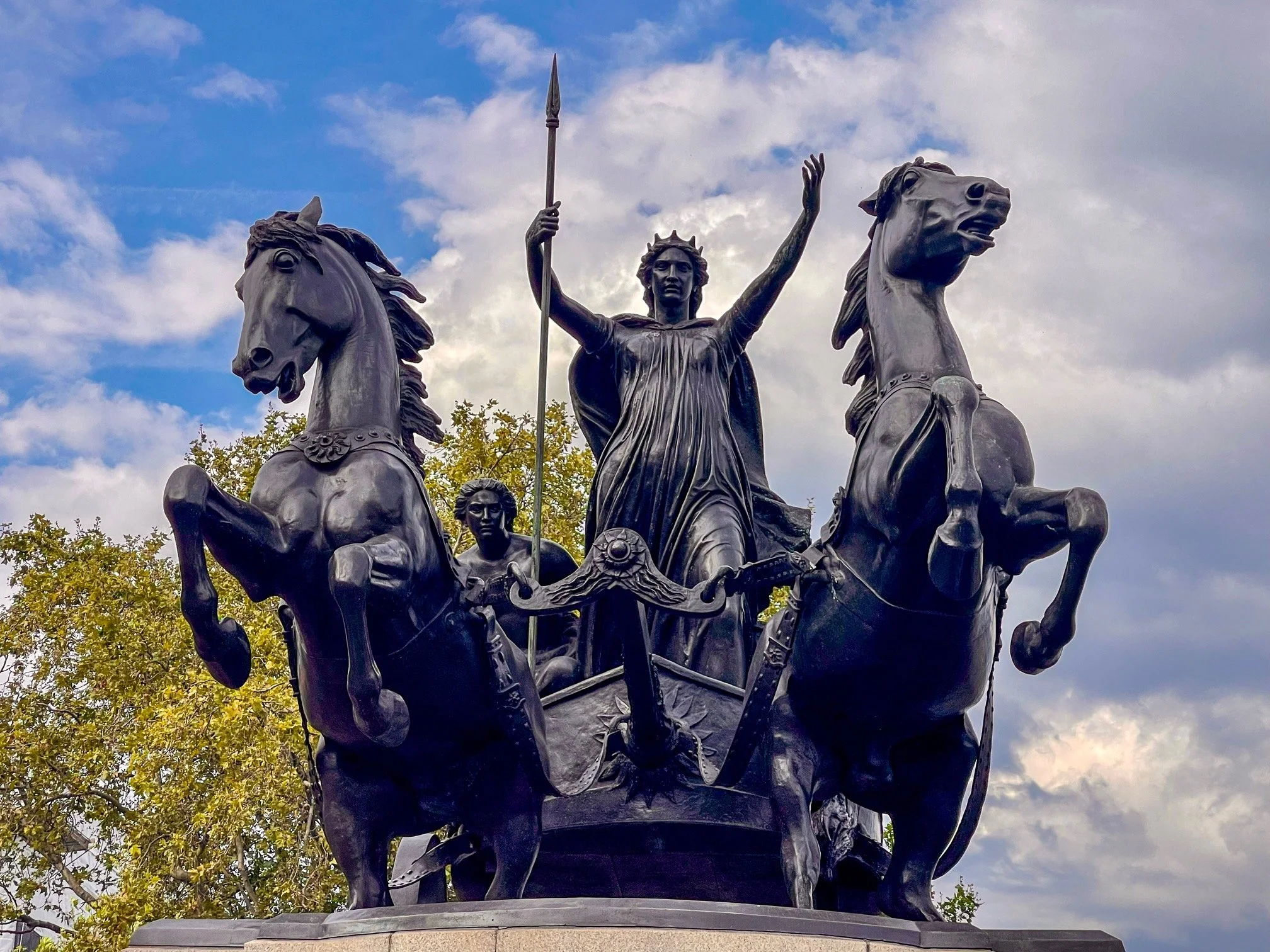  Three photos of “Boadicea and Her Daughters,” a bronze sculpture by Thomas Thornycroft that is perched prominently at the west end of Westminster Bridge in London.  Considered Thornycroft’s masterpiece, the statue depicts the spear-wielding Celtic q