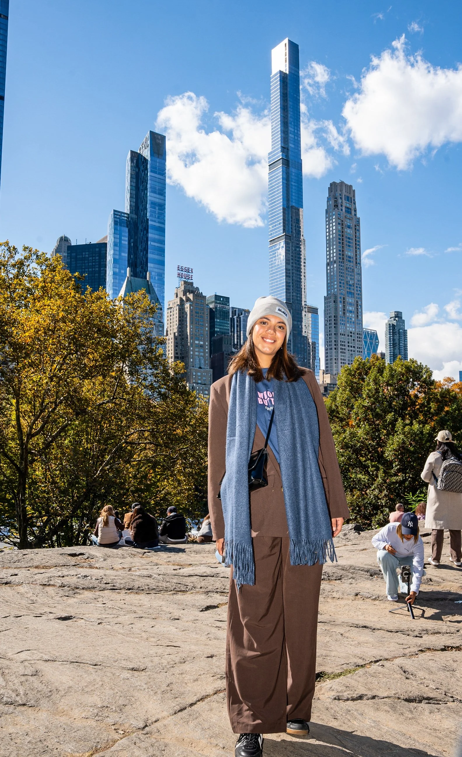 @ Girl with wool hat_rock-Central Park South skyline_10.26.25 copy.jpg