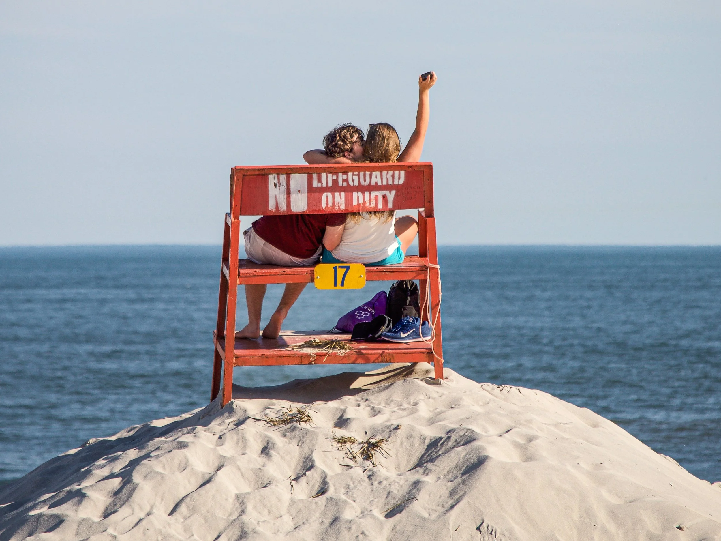  A couple get amorous on a lifeguard chair in Long Beach, Long Island.  