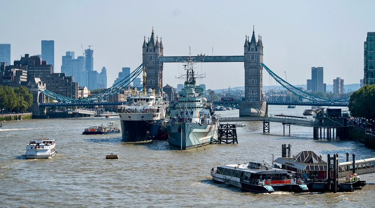  The HMS Belfast, right, is permanently moored on the River Thames near Tower Bridge. This warship was employed in World War II and the Korean War before becoming a museum operated by the Imperial War Museums.  On the left is the THV Galatea, a multi