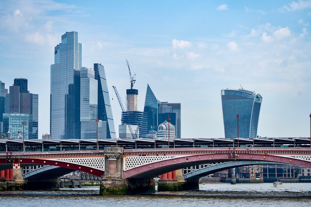  The City of London skyline overlooks Blackfriars Bridge on the River Thames. This bridge links the City of London to the London Borough of Southwark. The span opened in the 1860s, replacing an older bridge dismantled in the same decade. Civil engine