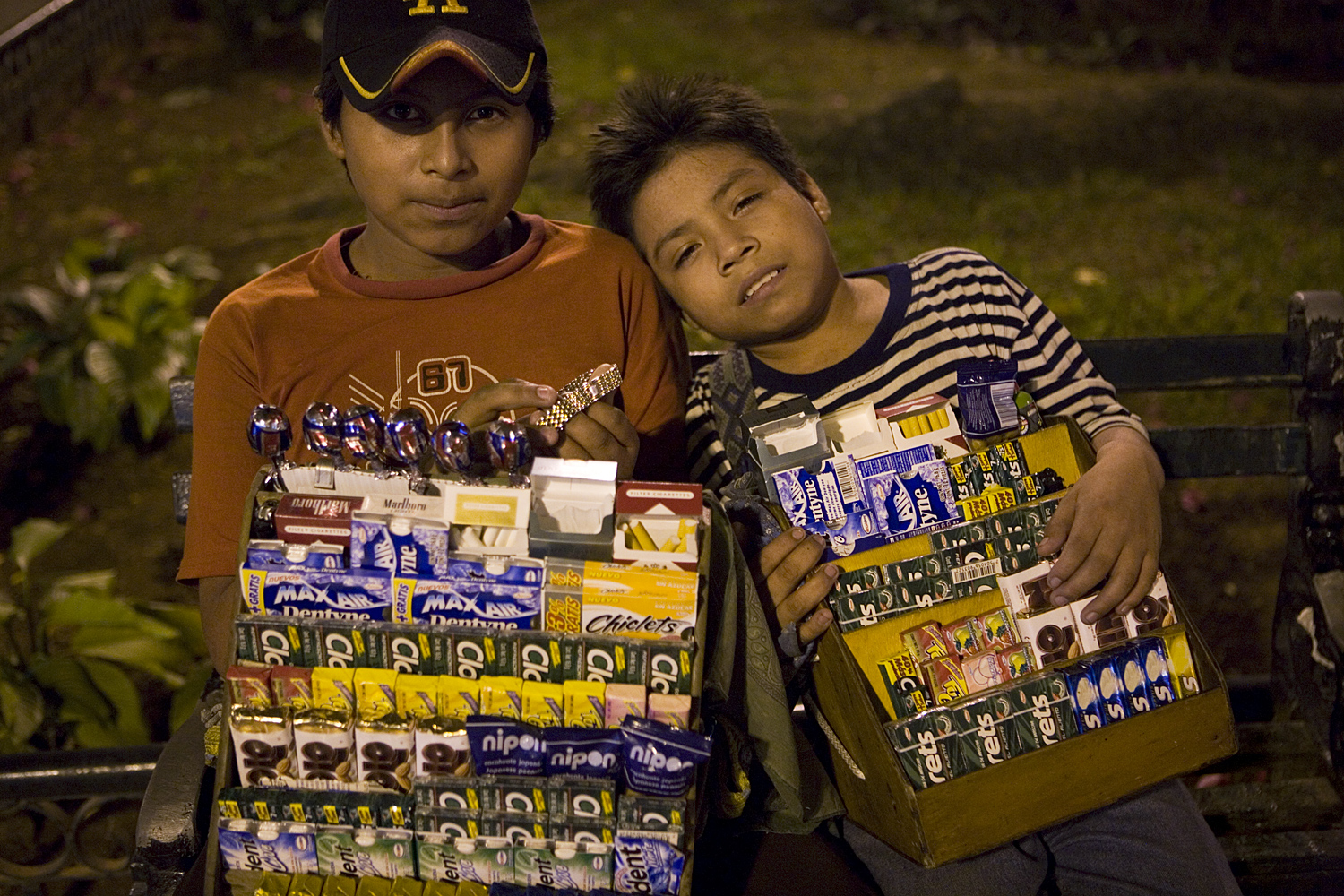  At midnight, two young boys sell their goods on the streets of Mérida. 