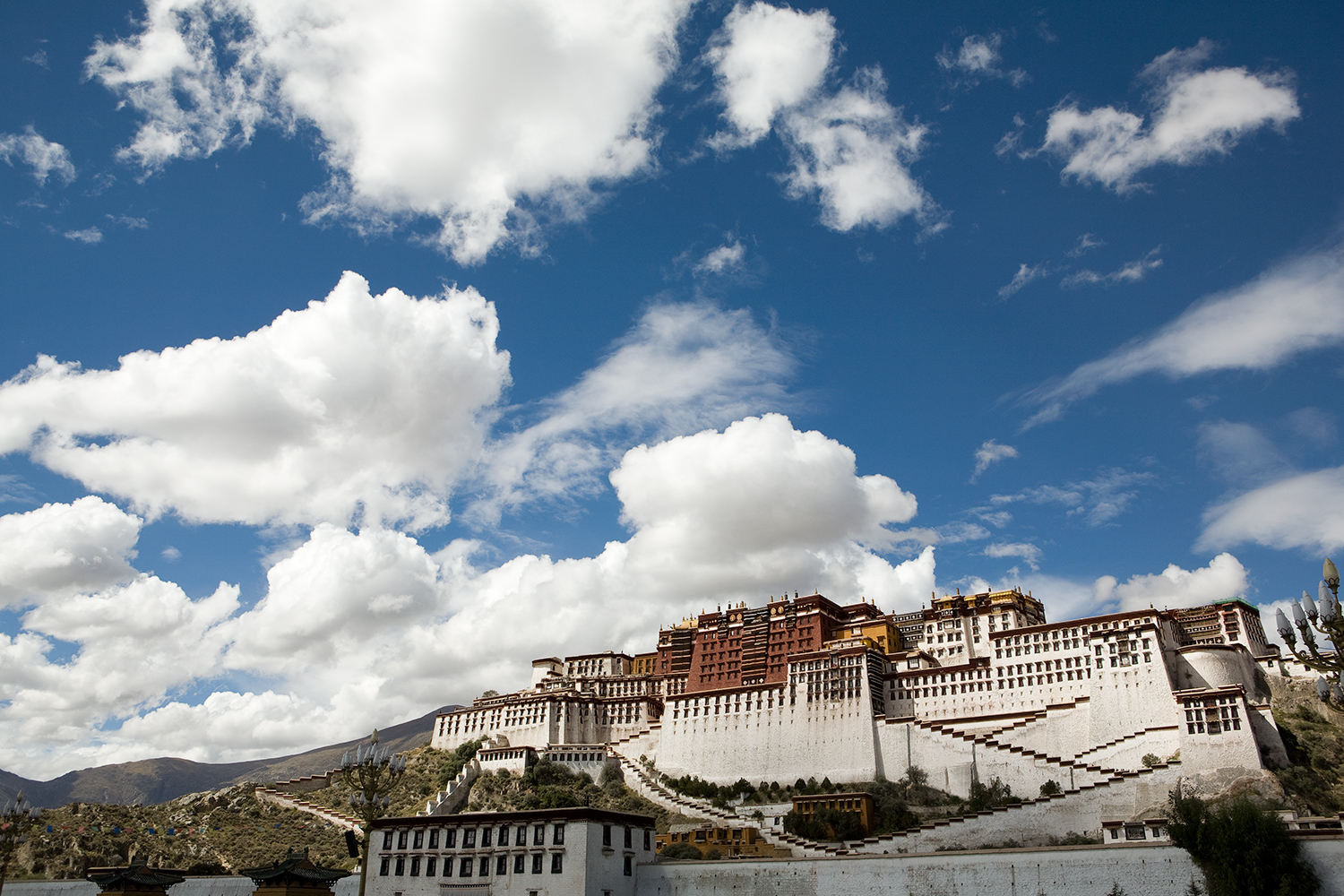  The Potala Palace in Lhasa is where the 14th Dalai Lama would be living if he still lived inside Tibet.  He fled the palace in 1959 for asylum in India.  