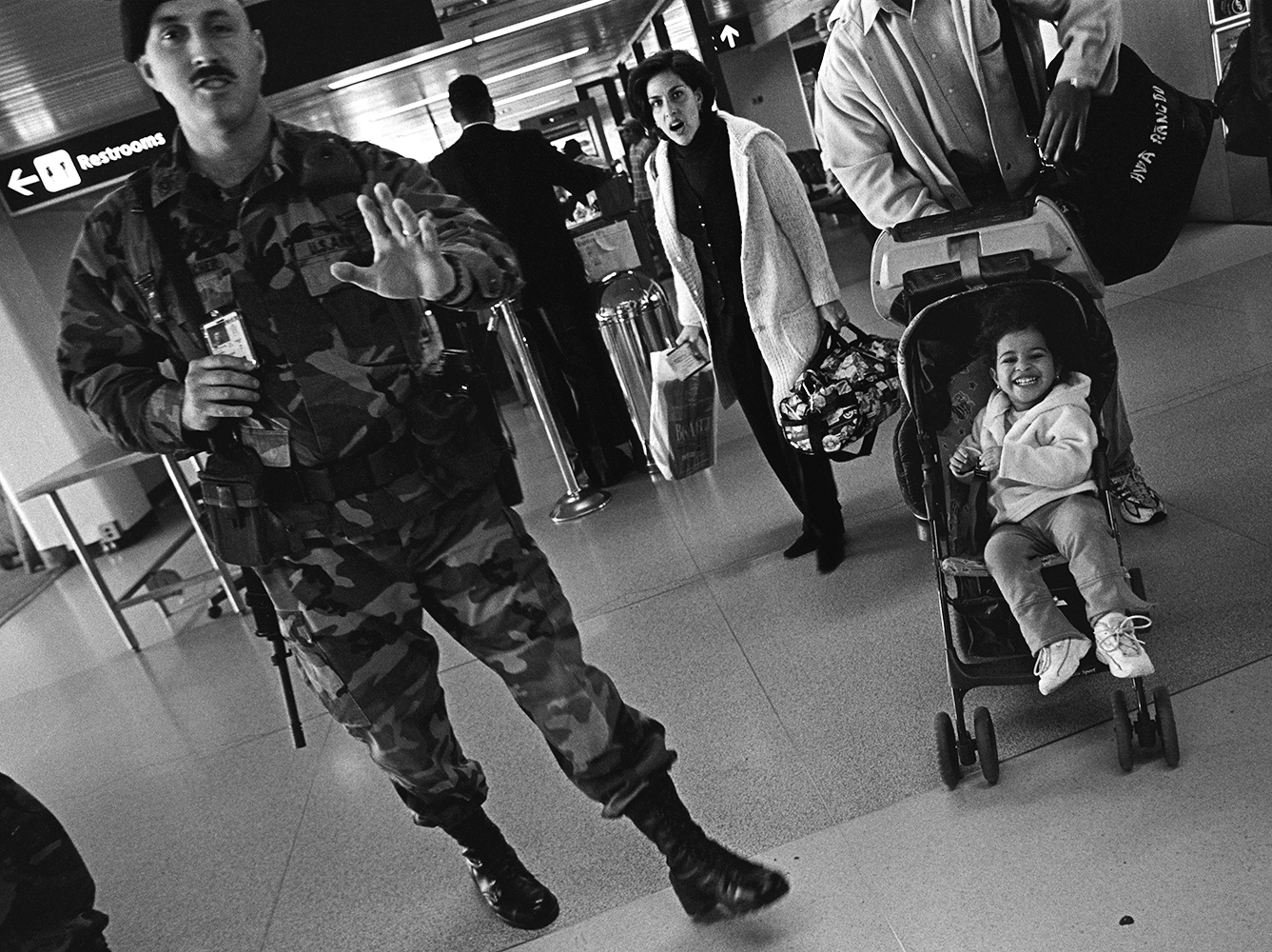  Security was strict at John F. Kennedy International airport on November 9, 2001. The soldier wanted to prevent photographs being made of the security checkpoint. Some people were generally skittish about security and photography after the attacks. 