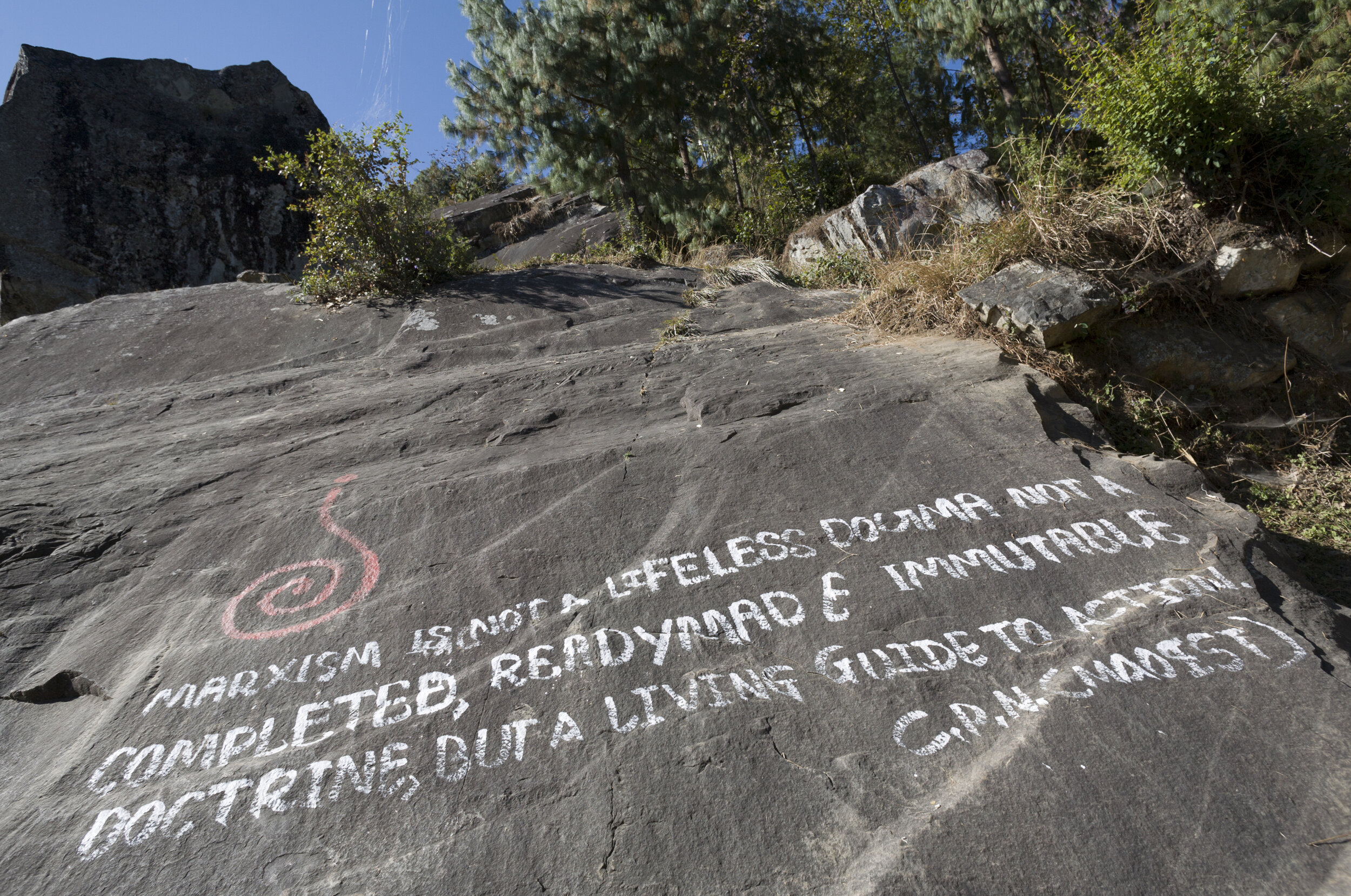  A Maoist quote, presumably written in English to make an impression on foreign trekkers, is painted on a massive stone on the trail. 