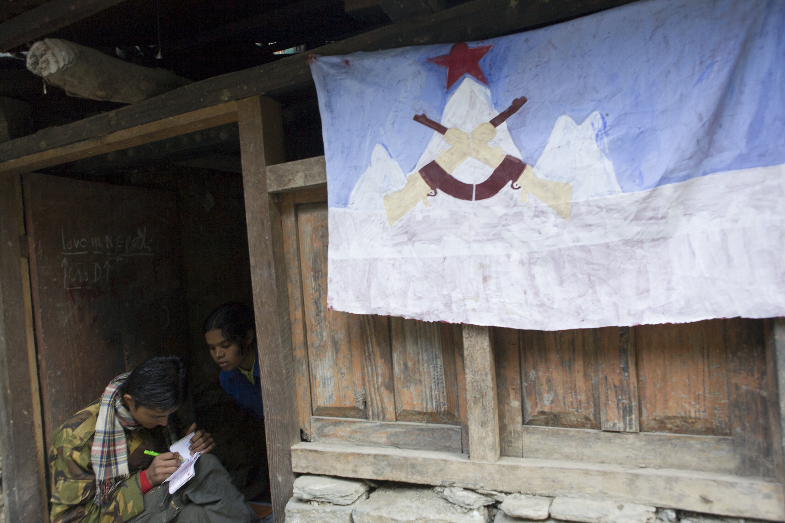  A Maoist rebel fills out a receipt for a payment made by a foreign Annapurna Circuit trekker. Such payments, or “taxes,” were required by the insurgent group in order to pass on the trail. Injuries have been reported by trekkers who refused to pay t