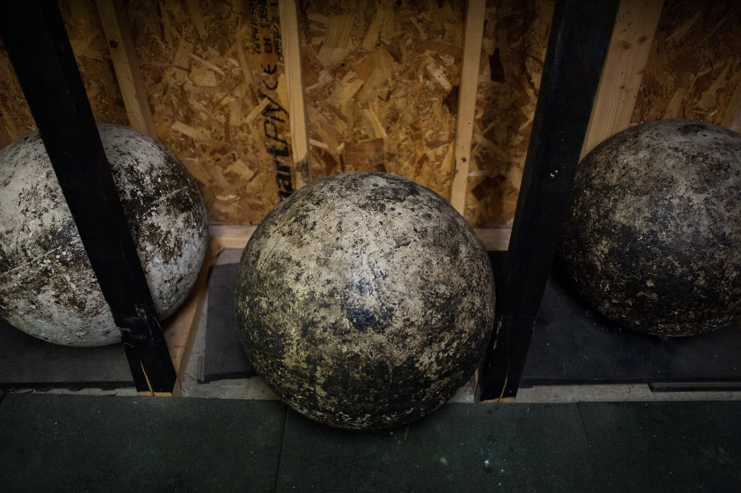  Atlas stones from 60-200kg lay under a handmade stone platform. 