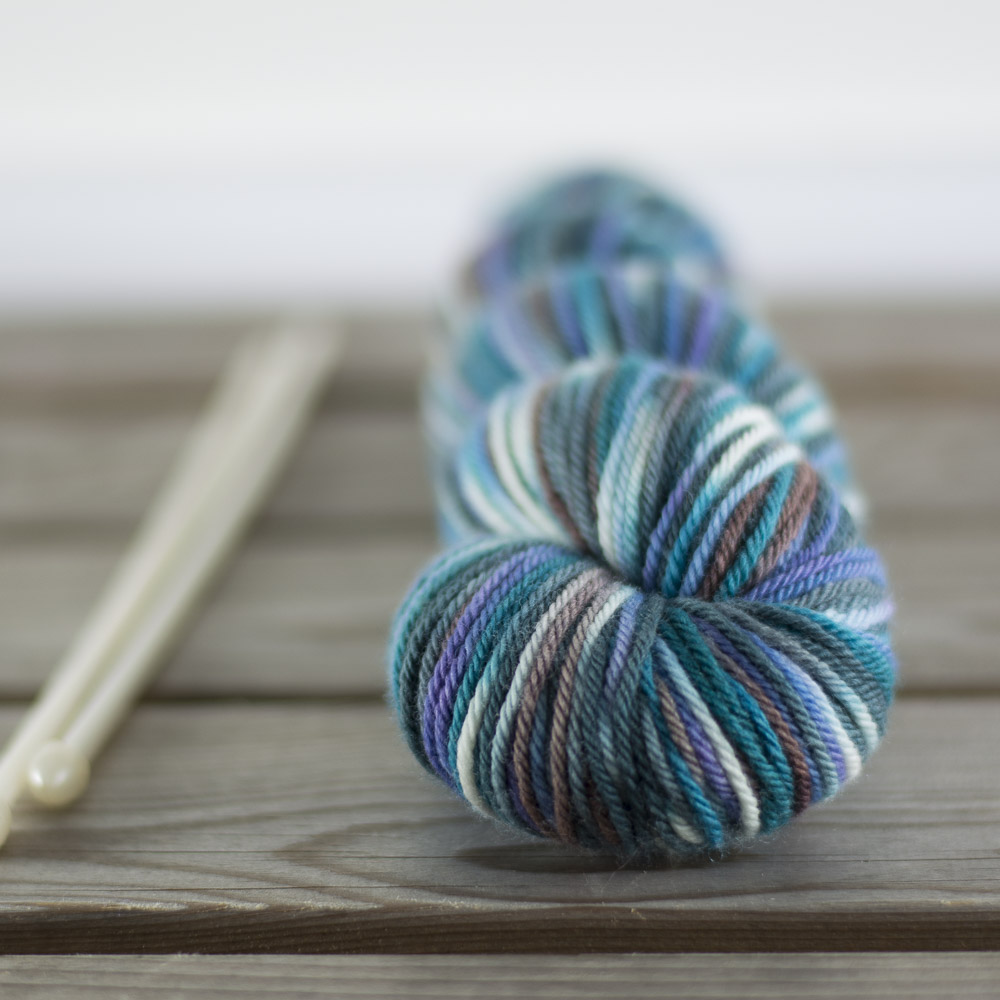 Sustainable Merino DK in " Still Waters Run Deep ." "Still Waters" has pronounced contrasts in both hue and value, so it will pool more obviously than . . . 