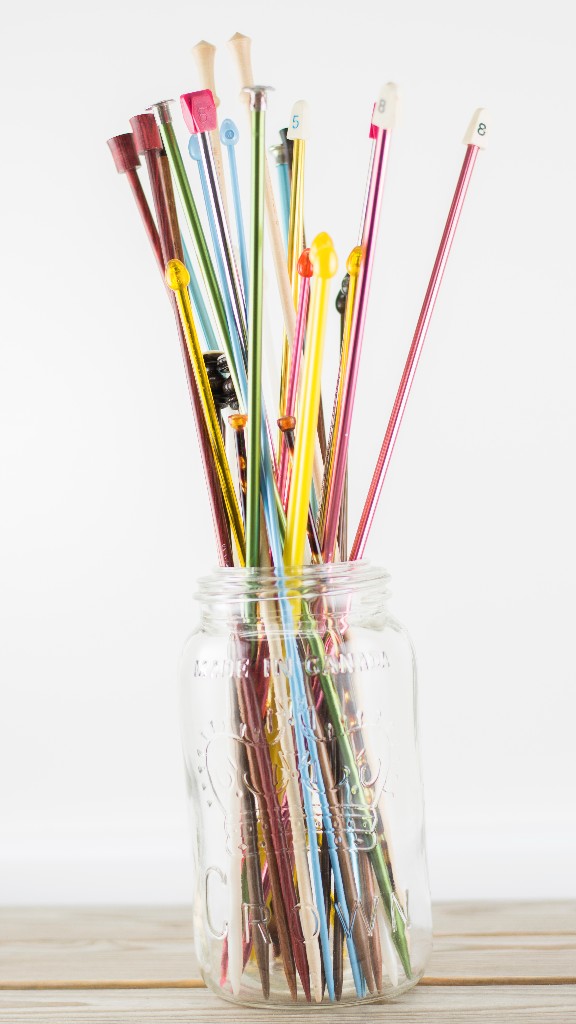 My straight needles. I don't knit with them, but I love to include them in product photos.