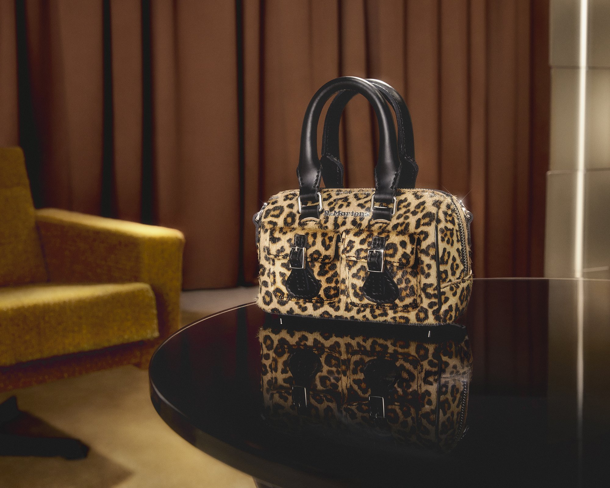 AW25_HOLIDAY_DRMARTENS_43014001_MINITOPHANDLEBAG_BAG_LEOPARD_BLACK_STILLLIFE_(2).jpg
