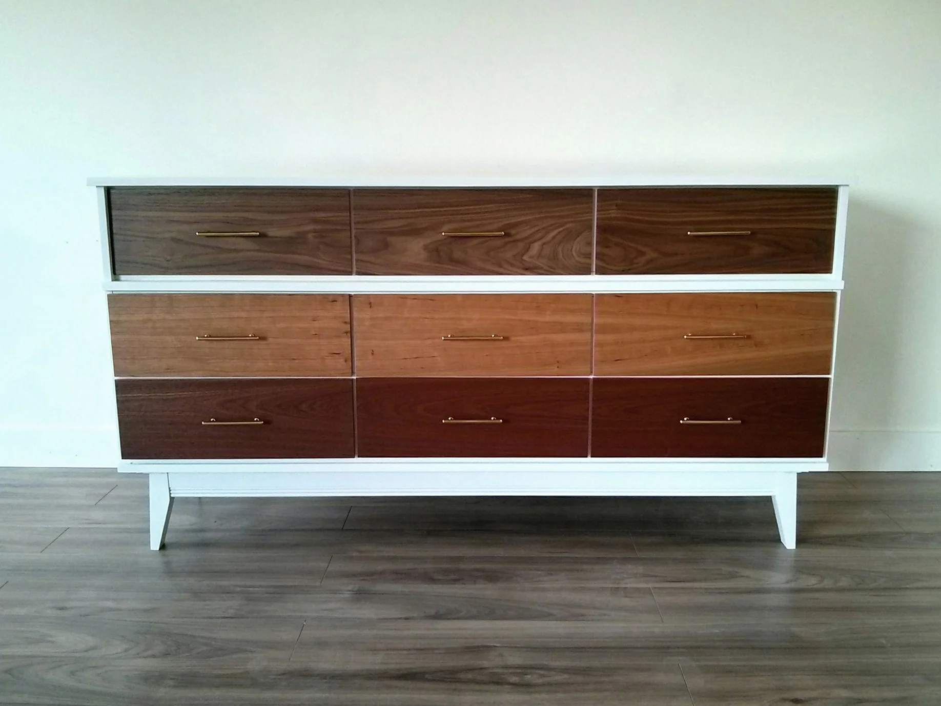 ...the wood grain travels from one drawer to the next....no repeats! ;)