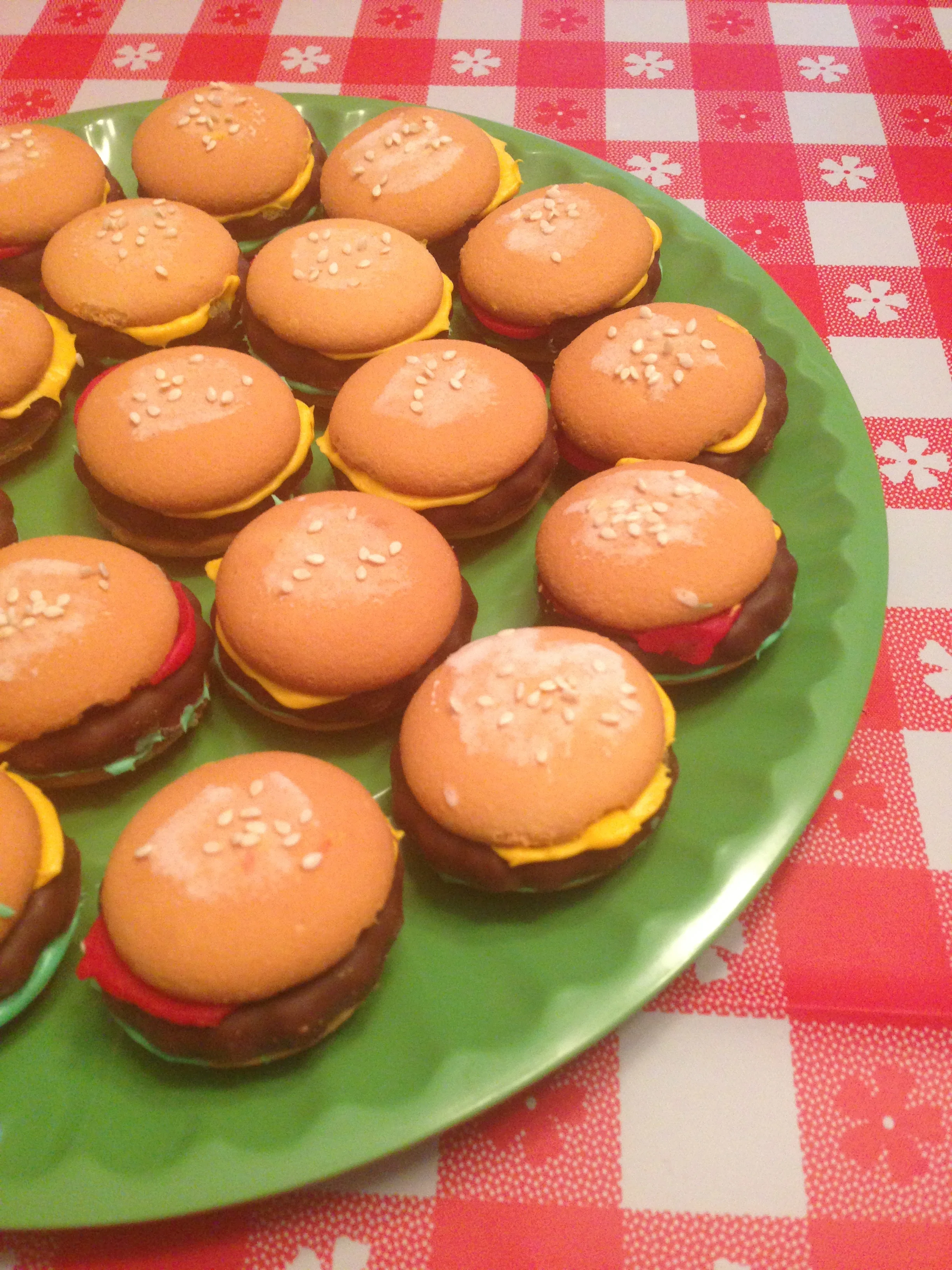 the cutest hamburger cookies! nilla wafers (buns), grasshoppers (burger) and frosting for the lettuce, mustard and ketchup!