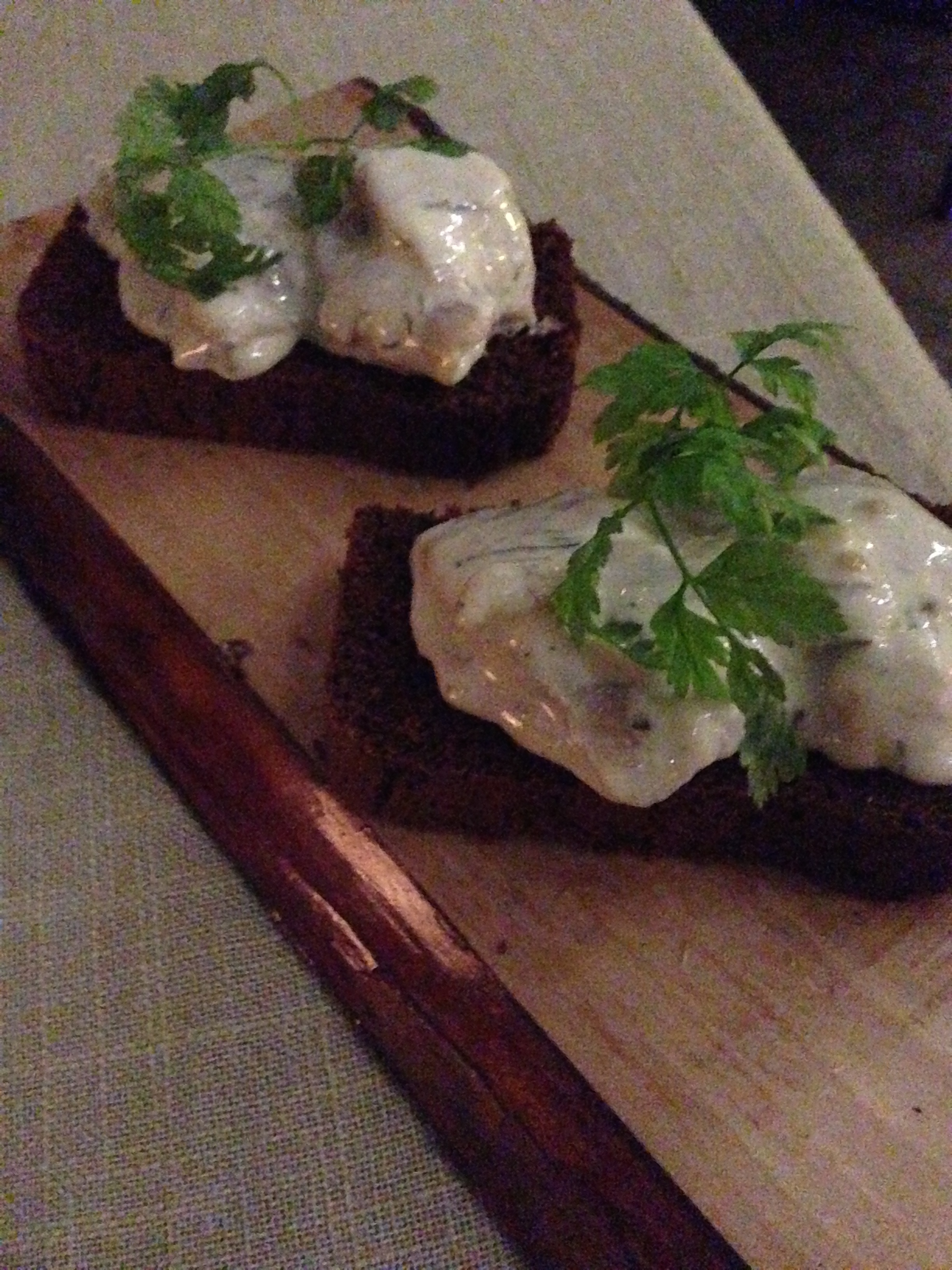 Second course: Skyr-herring with bananas and homemade dandelion syrup with homemade hot spring cooked rye bread. (Note: skyr is a thick, traditional Icelandic yogurt)