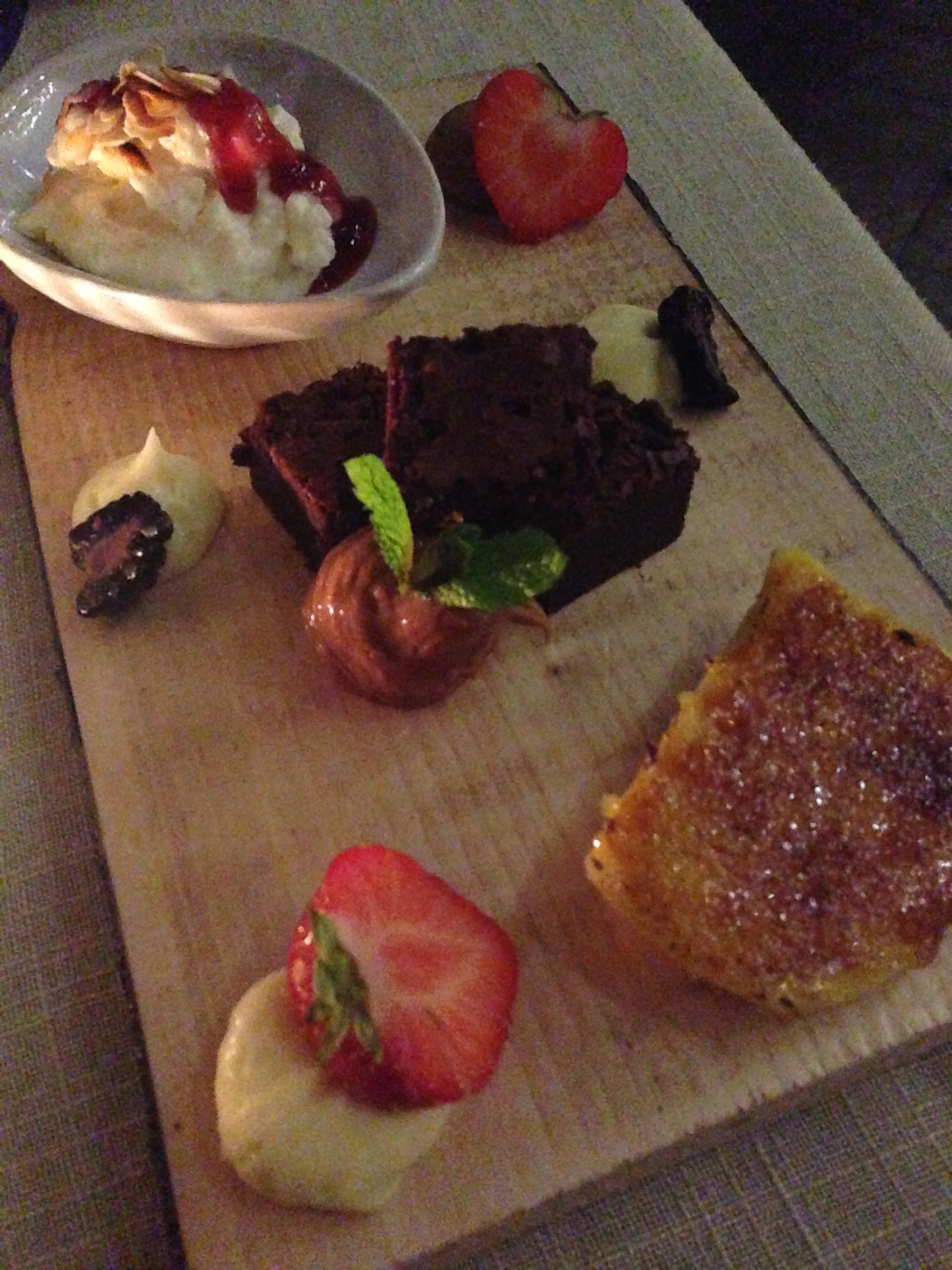 Ninth Course: Dessert Part 2 - a platter of assorted treats including creme brulee, chocolate dream cake and ris a la mande (traditional rice pudding with almonds) along with fresh strawberries and accents of white chocolate, caramel and milk chocolate mousse