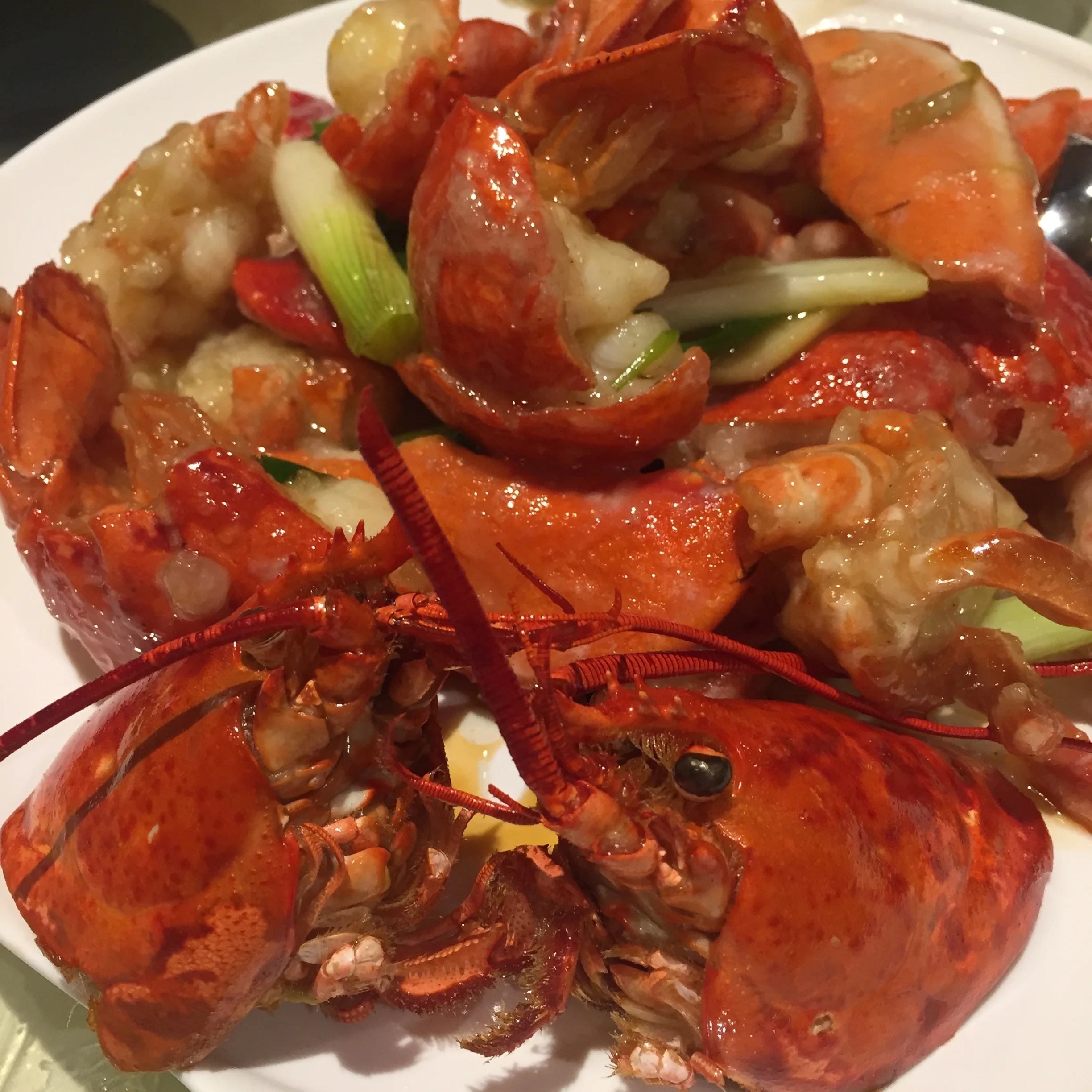 Twin lobsters with ginger and scallions