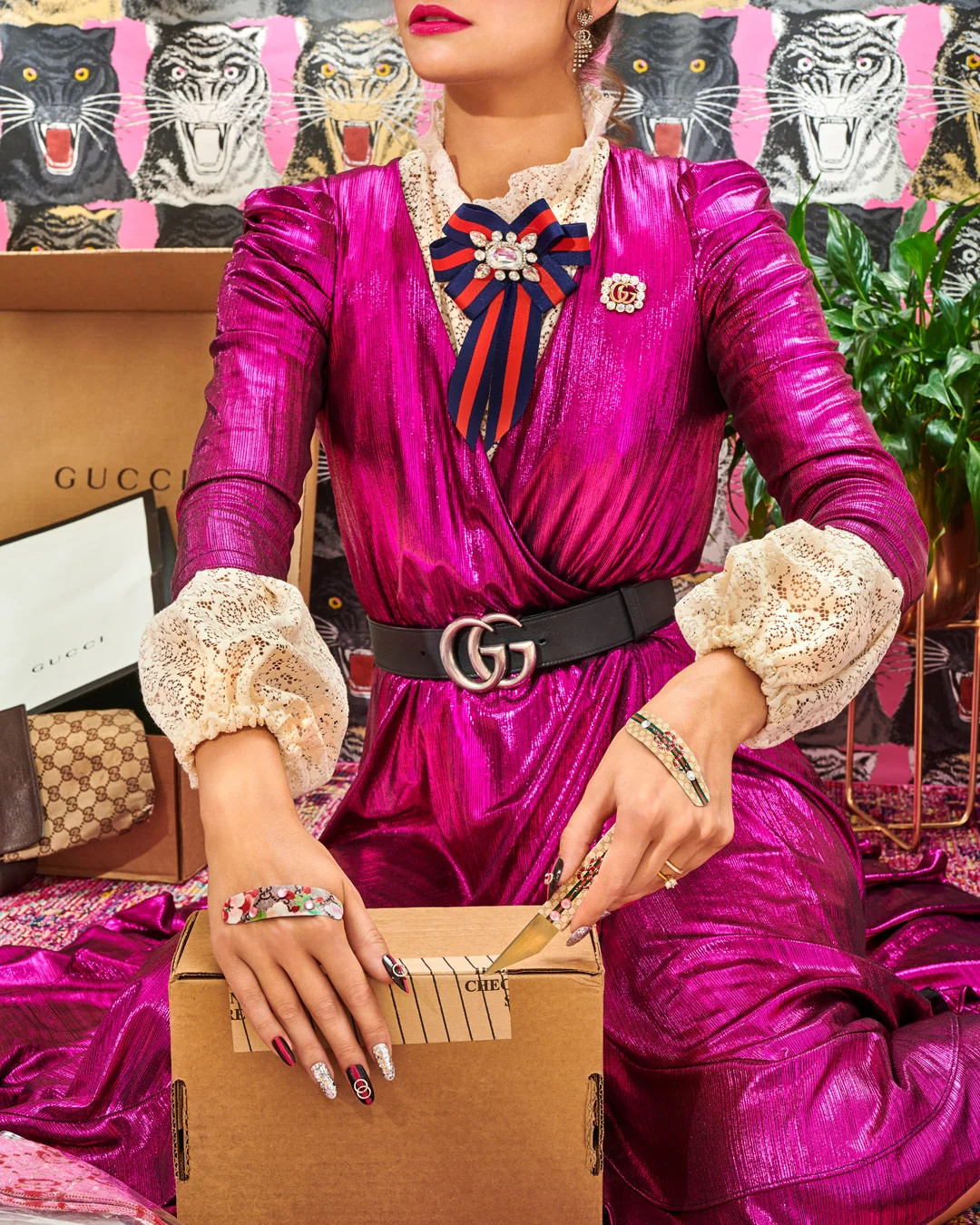 credits: Photo - Jenna Gang, Sets - Anna Lemi, Wardrobe - Ross McCallum, Hair - Mark Esparza, Nails - Noriko Yamanaka, Makeup - Ashley Victoria, Model - Gabrielle Chappel description: model cutting her hand after opening so many boxes.