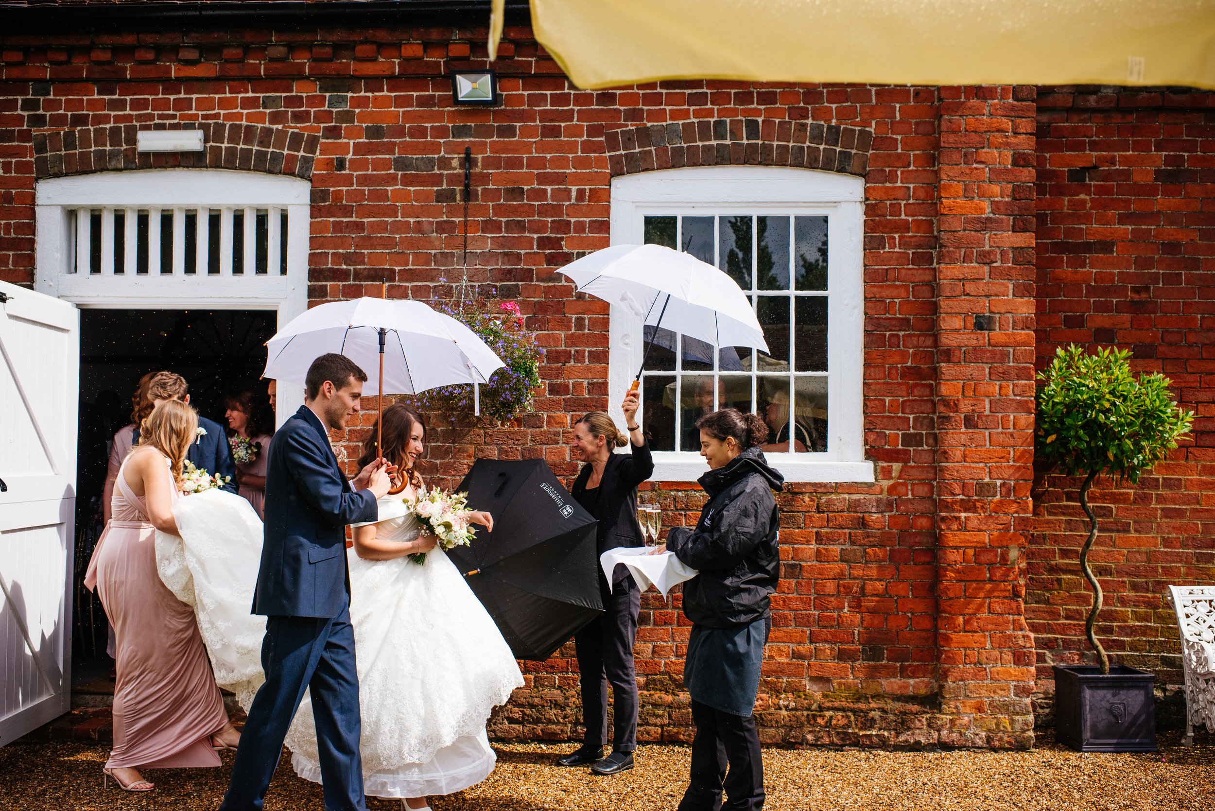 21 Lillibrooke Manor Berkshire Bride Groom Umbrella Wedding Photography.jpg
