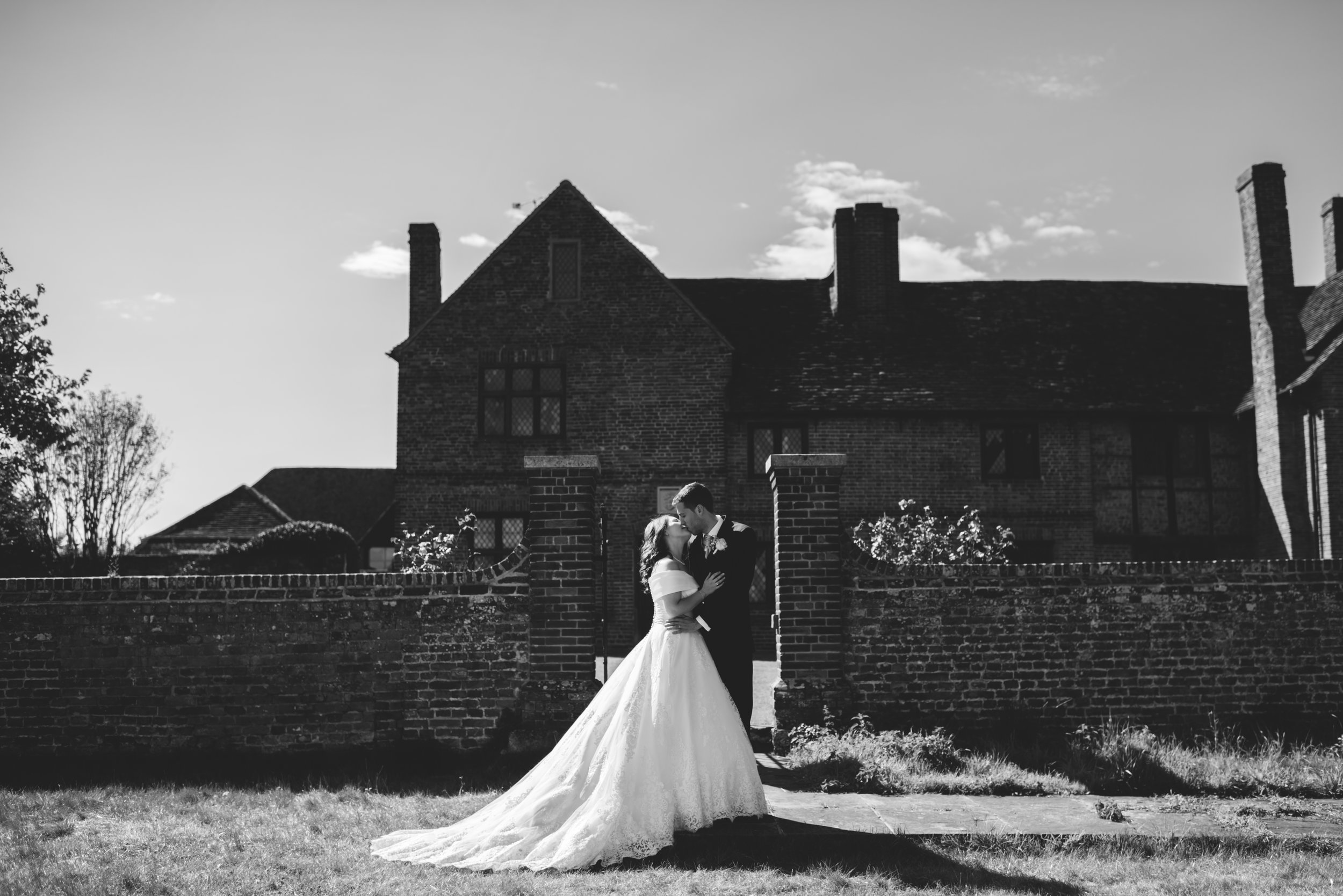 23 Lillibrooke Manor Berkshire Bride Groom Kiss  Wedding Photography.jpg