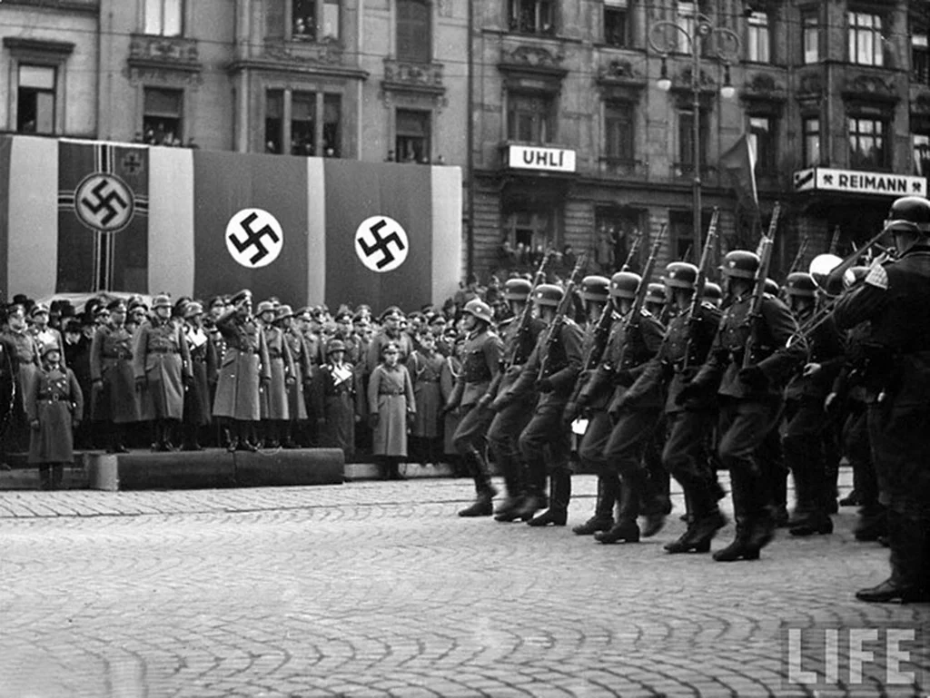 Hitler arrives in Prague in March 1939, the day Germany completes its occupation of Czechoslovakia