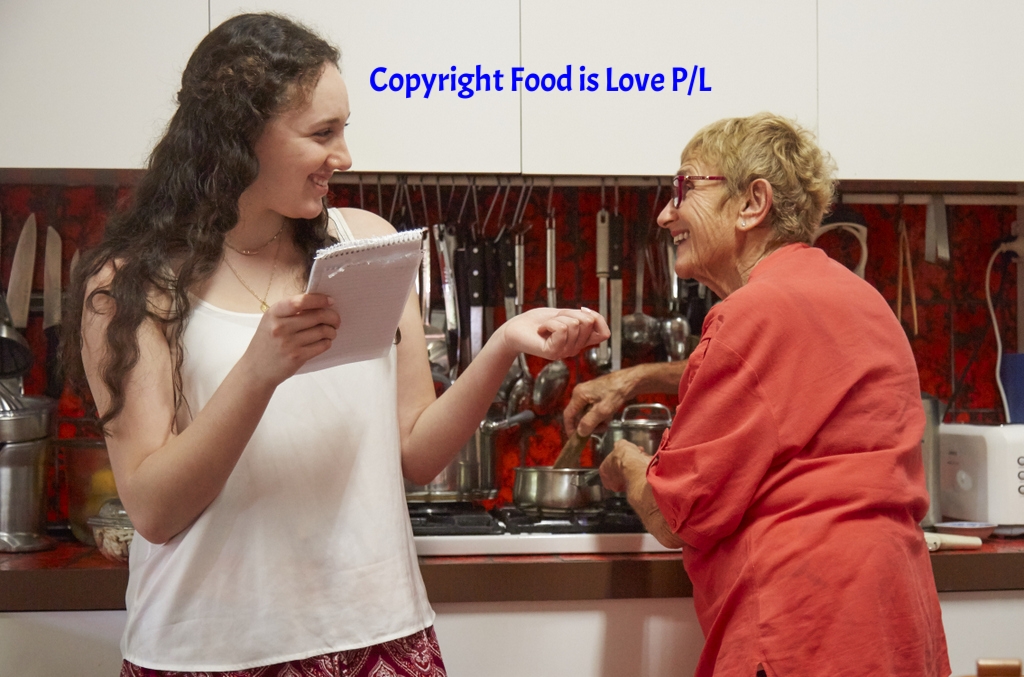 Aviva checks a recipe with her grandmother, Judy Kolt