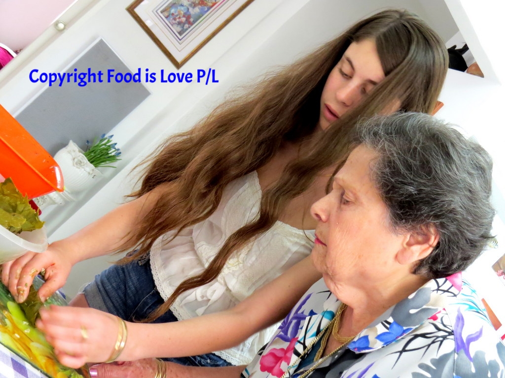 Intense concentration as Jerusalem grandmother Rina Mevorach prepares vine-leaves with her grand-daughter Enelle Mevorach. No mistakes allowed!
