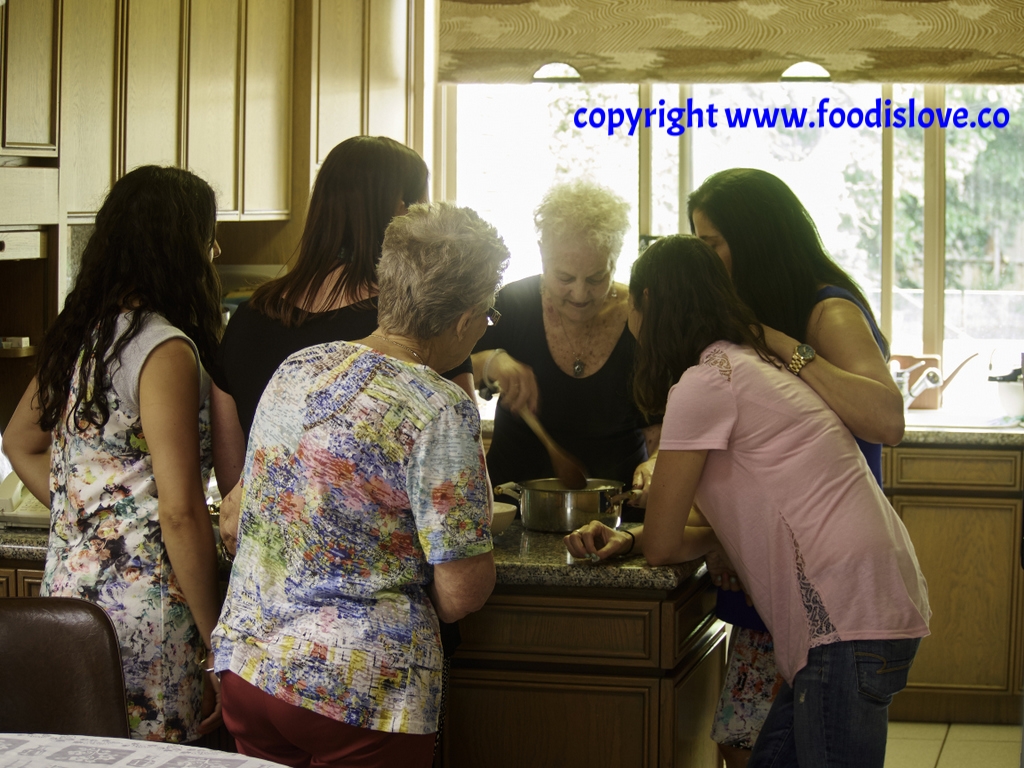 Viviane Levy's family watch and learn. Almost a shrine to chicken soup!