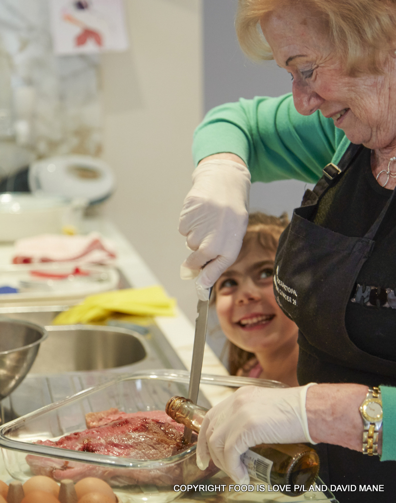 Ruth Hampel, in Melbourne, with great-grand daughter Siena peeking up. 
